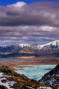 Preview wallpaper mountains, clouds, lake, height, sea, coast, snow, spring, sky