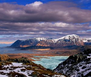 Preview wallpaper mountains, clouds, lake, height, sea, coast, snow, spring, sky