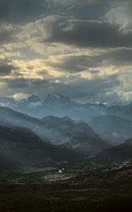 Preview wallpaper mountains, clouds, light, rays, twilight, landscape
