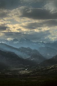 Preview wallpaper mountains, clouds, light, rays, twilight, landscape