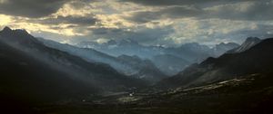Preview wallpaper mountains, clouds, light, rays, twilight, landscape