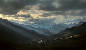 Preview wallpaper mountains, clouds, light, rays, twilight, landscape