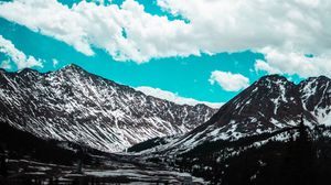 Preview wallpaper mountains, clouds, sky, snowy, porous