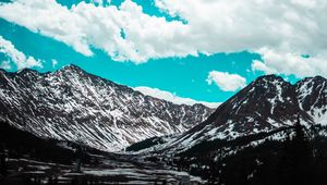 Preview wallpaper mountains, clouds, sky, snowy, porous