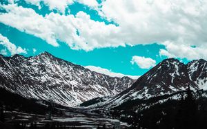 Preview wallpaper mountains, clouds, sky, snowy, porous