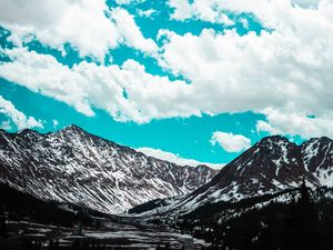 Preview wallpaper mountains, clouds, sky, snowy, porous