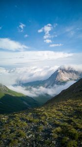 Preview wallpaper mountains, clouds, slope, grass, nature