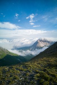 Preview wallpaper mountains, clouds, slope, grass, nature