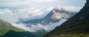 Preview wallpaper mountains, clouds, slope, grass, nature