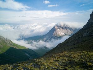Preview wallpaper mountains, clouds, slope, grass, nature