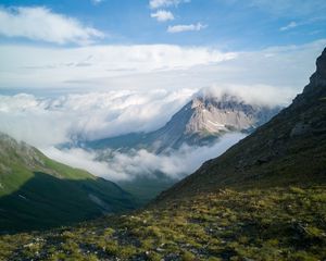 Preview wallpaper mountains, clouds, slope, grass, nature