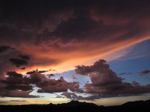 Preview wallpaper mountains, clouds, sunset, sky, cloudy