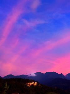 Preview wallpaper mountains, clouds, village, light, sky, aerial view