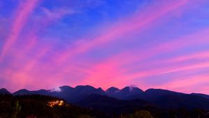 Preview wallpaper mountains, clouds, village, light, sky, aerial view