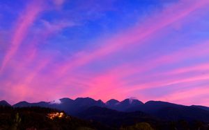 Preview wallpaper mountains, clouds, village, light, sky, aerial view