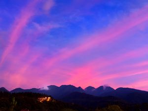 Preview wallpaper mountains, clouds, village, light, sky, aerial view