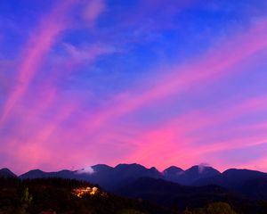 Preview wallpaper mountains, clouds, village, light, sky, aerial view