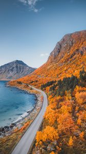 Preview wallpaper mountains, coast, road, autumn