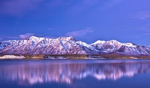 Preview wallpaper mountains, coast, snow-covered, reflection, sky, blue