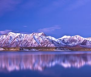 Preview wallpaper mountains, coast, snow-covered, reflection, sky, blue