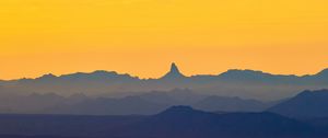 Preview wallpaper mountains, dusk, fog, sunset, orange
