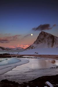 Preview wallpaper mountains, evening, moon, snow, stones, ocean