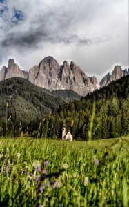 Preview wallpaper mountains, field, structure, grass, italy