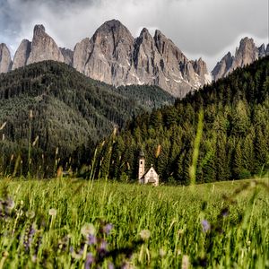 Preview wallpaper mountains, field, structure, grass, italy