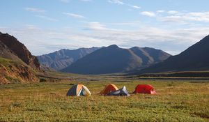 Preview wallpaper mountains, field, tents, hike, nature