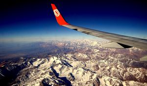 Preview wallpaper mountains, flight, ridge, height, wing, plane, red