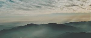Preview wallpaper mountains, fog, aerial view, horizon, sky, clouds