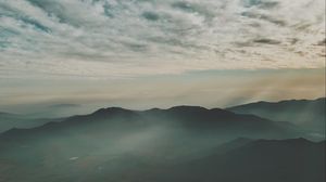 Preview wallpaper mountains, fog, aerial view, horizon, sky, clouds