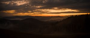 Preview wallpaper mountains, fog, dusk, sunset, clouds, aerial view