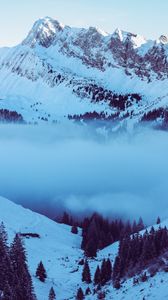 Preview wallpaper mountains, fog, peak, snow, snowy, twilight