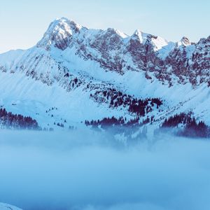 Preview wallpaper mountains, fog, peak, snow, snowy, twilight