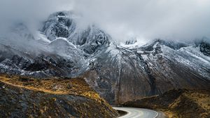 Preview wallpaper mountains, fog, road, rocks