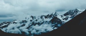 Preview wallpaper mountains, fog, sky, peaks, snow-covered