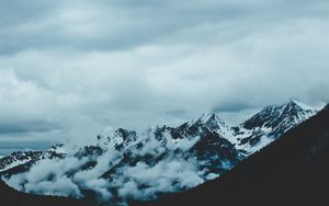 Preview wallpaper mountains, fog, sky, peaks, snow-covered