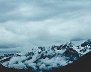 Preview wallpaper mountains, fog, sky, peaks, snow-covered