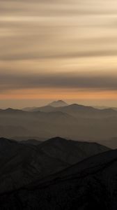 Preview wallpaper mountains, fog, sky, sunset, distance