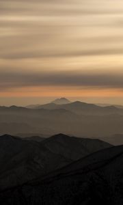 Preview wallpaper mountains, fog, sky, sunset, distance