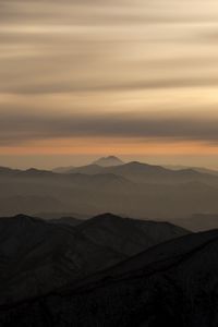 Preview wallpaper mountains, fog, sky, sunset, distance