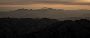 Preview wallpaper mountains, fog, sky, sunset, distance