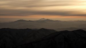 Preview wallpaper mountains, fog, sky, sunset, distance