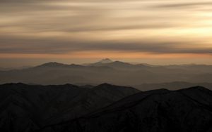 Preview wallpaper mountains, fog, sky, sunset, distance