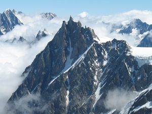 Preview wallpaper mountains, fog, sky, snow, peaks