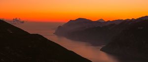 Preview wallpaper mountains, fog, sunset, lake, italy