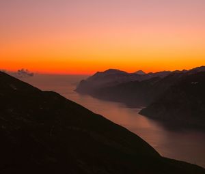 Preview wallpaper mountains, fog, sunset, lake, italy