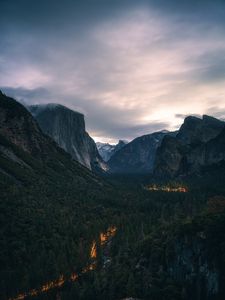 Preview wallpaper mountains, forest, road, glow, aerial view