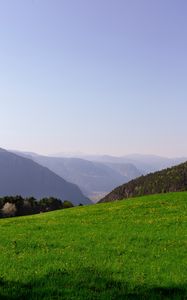 Preview wallpaper mountains, glade, grass, fog